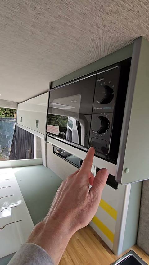 kitchen microwave open hand