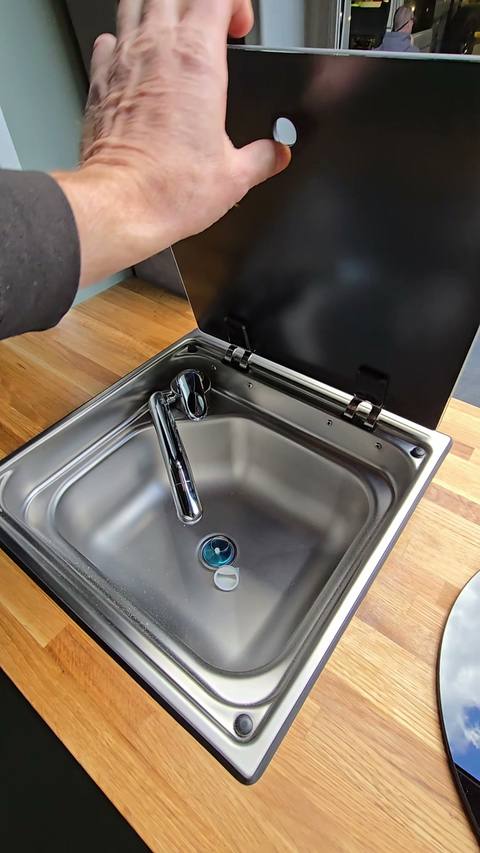 sink oak lid open hand